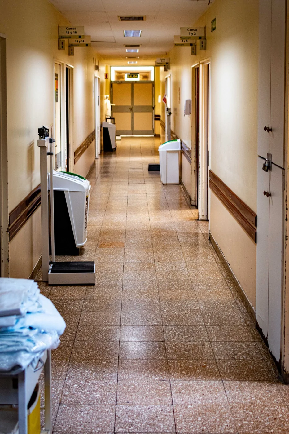A hospital corridor with clinical equipment